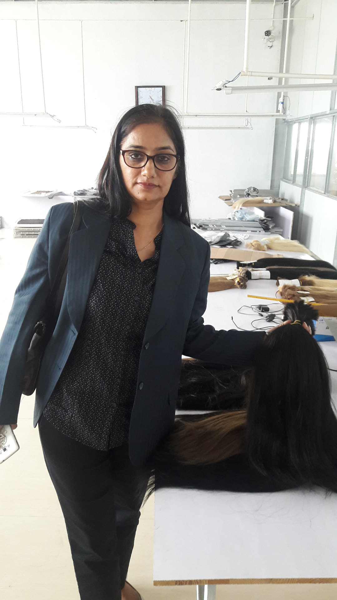 RemyPatra quality controller inspecting bundles on the sorting table
