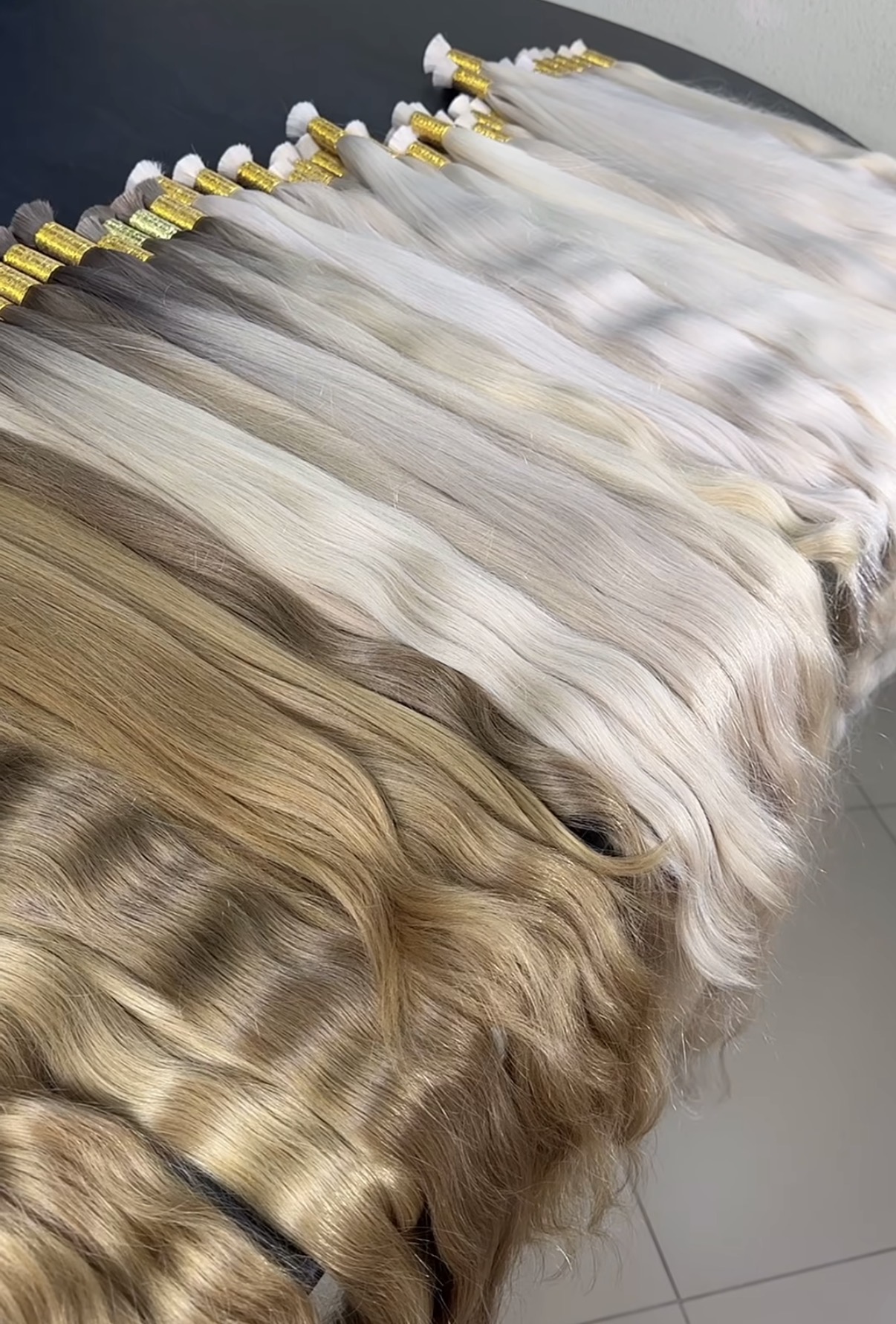 Finished pale ash, pearl and natural blonde hair prepared for Russian hair buyers