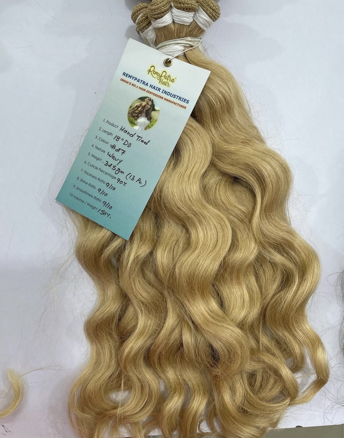 RemyPatra hand-tied 18 inch double drawn #27 wavy bundle with its signed specification tag