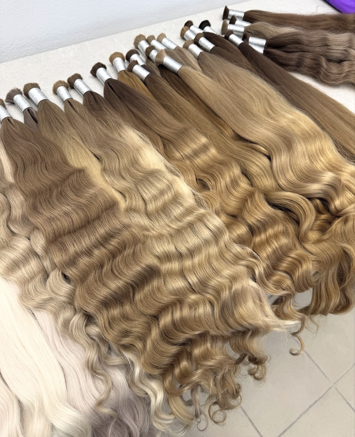 Developed warm Russian shade range in straight, wave and curl textures