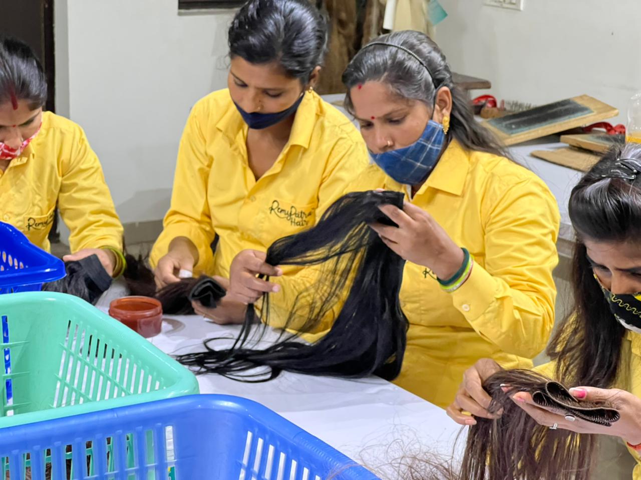 RemyPatra sorting line inspecting raw dark hair before processing