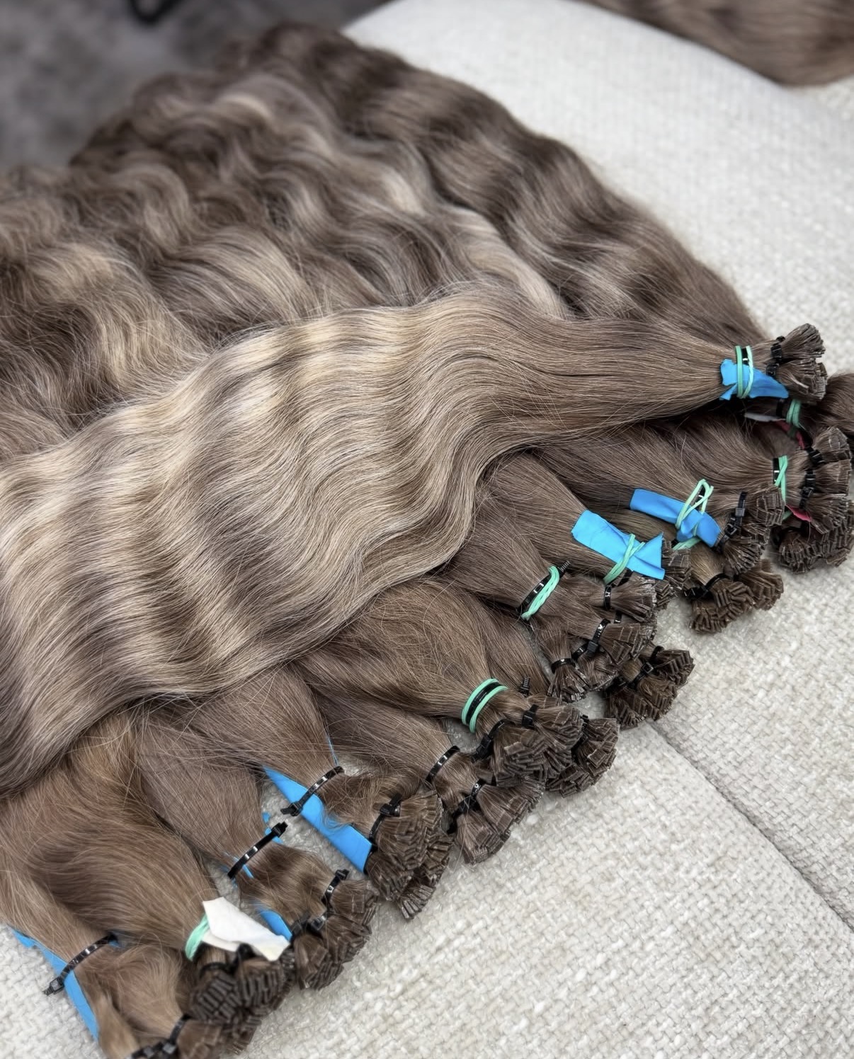 Developed Indian baby hair in natural brown and blonde curl patterns