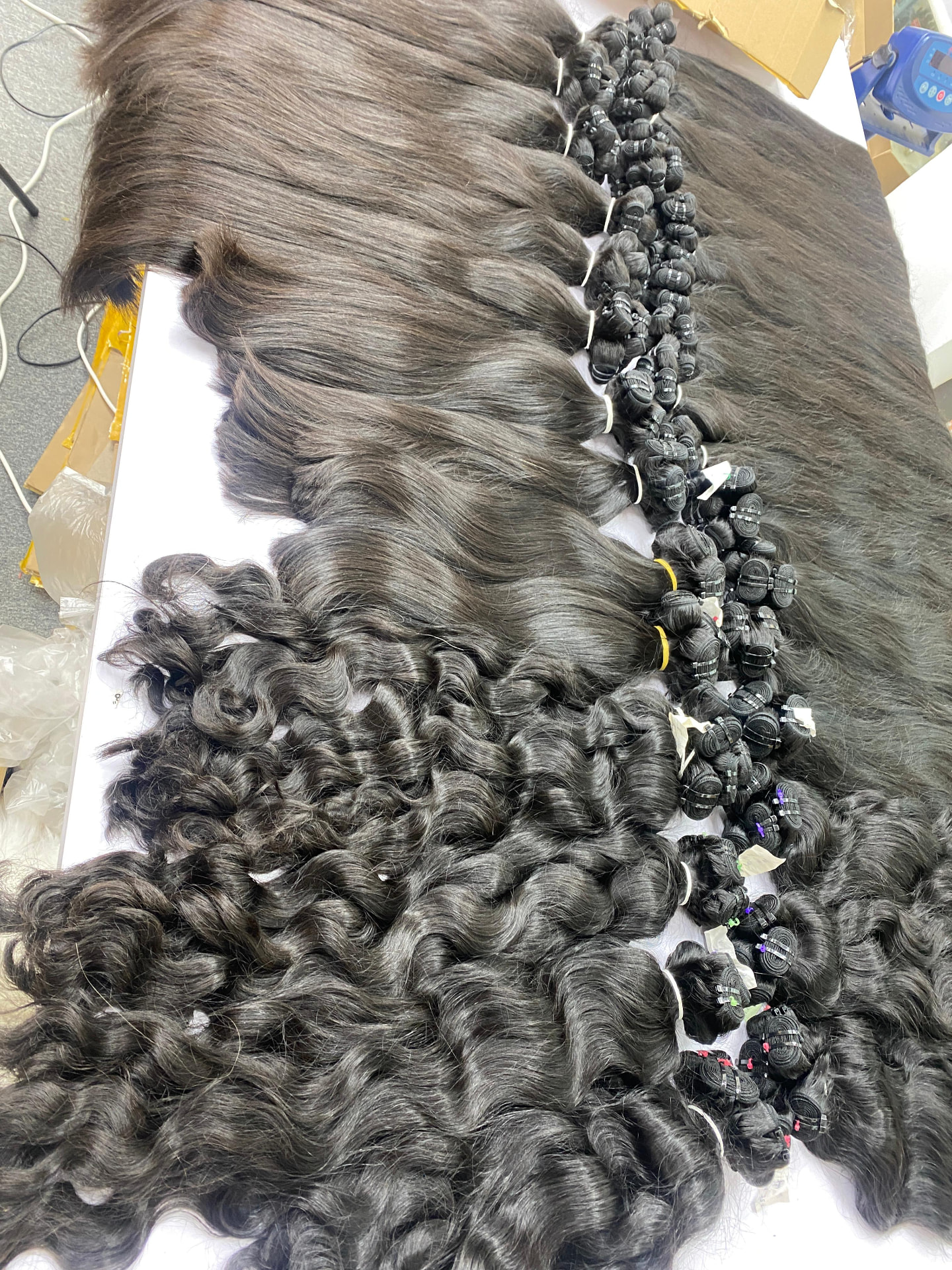 Mixed straight and wavy temple-hair lots weighed on the factory