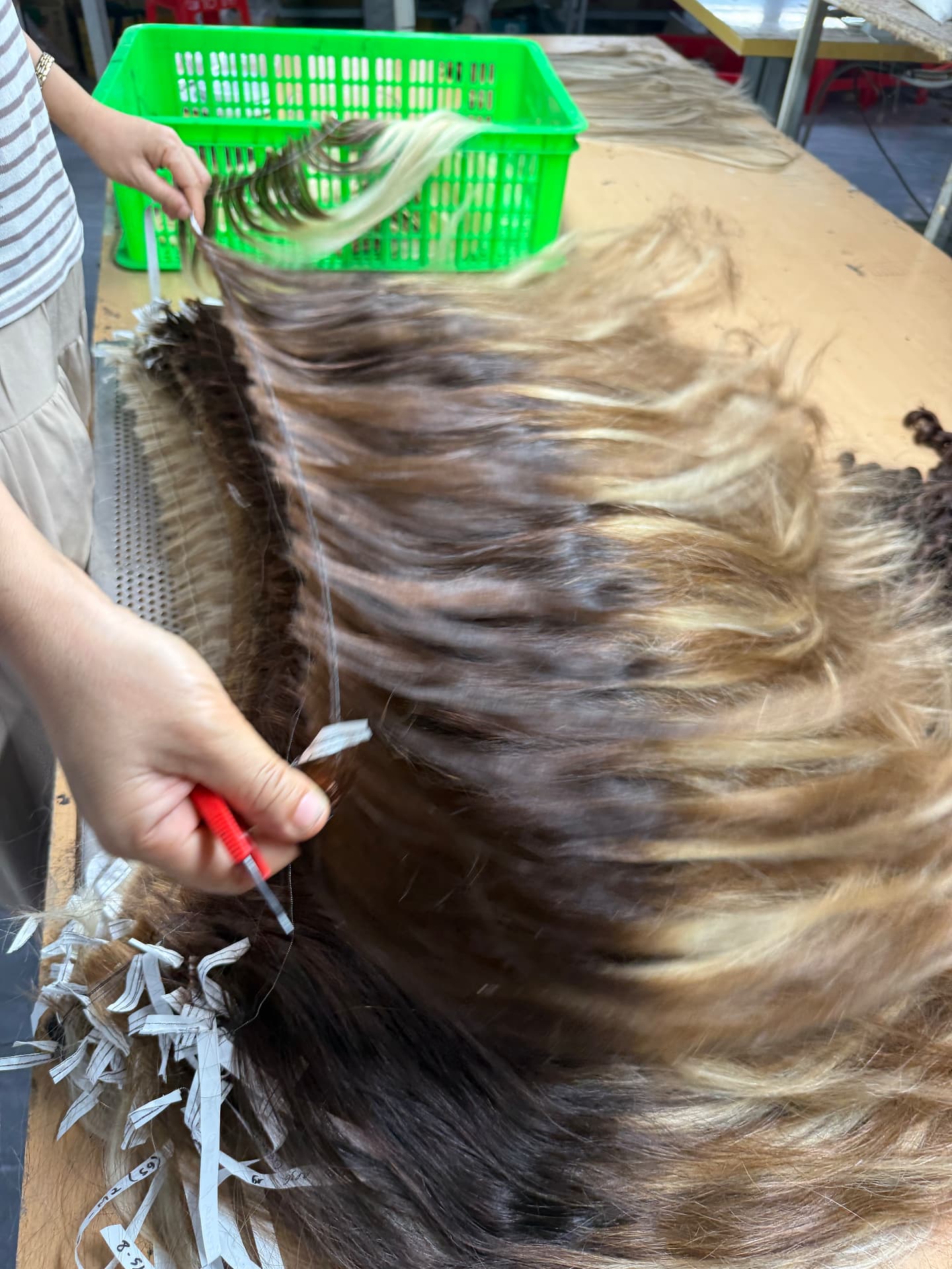 Multi-tone hair lots separated, labelled and prepared by hand in the Manipur factory