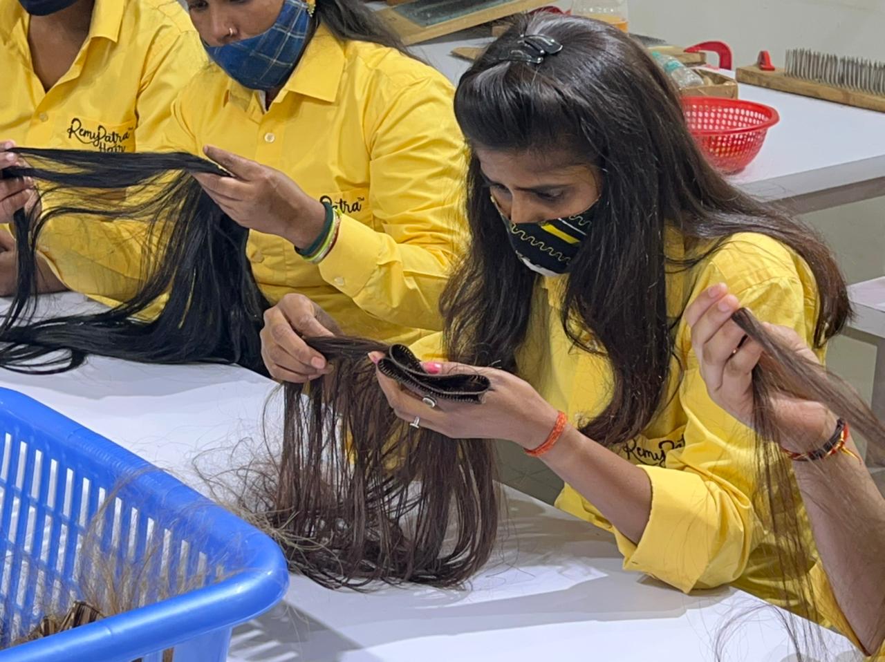 RemyPatra sorters hackling dark Indian hair with the cuticle intact