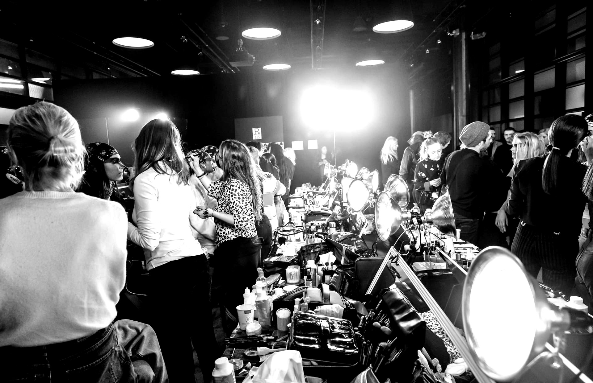 Backstage hair and make-up room in full production before a show