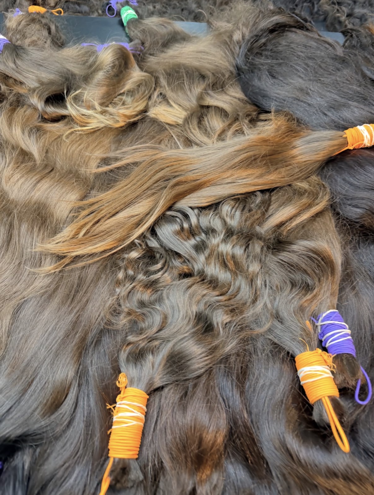 Close view of fine cool-toned Middle Eastern brown hair with natural sun-lifted ends