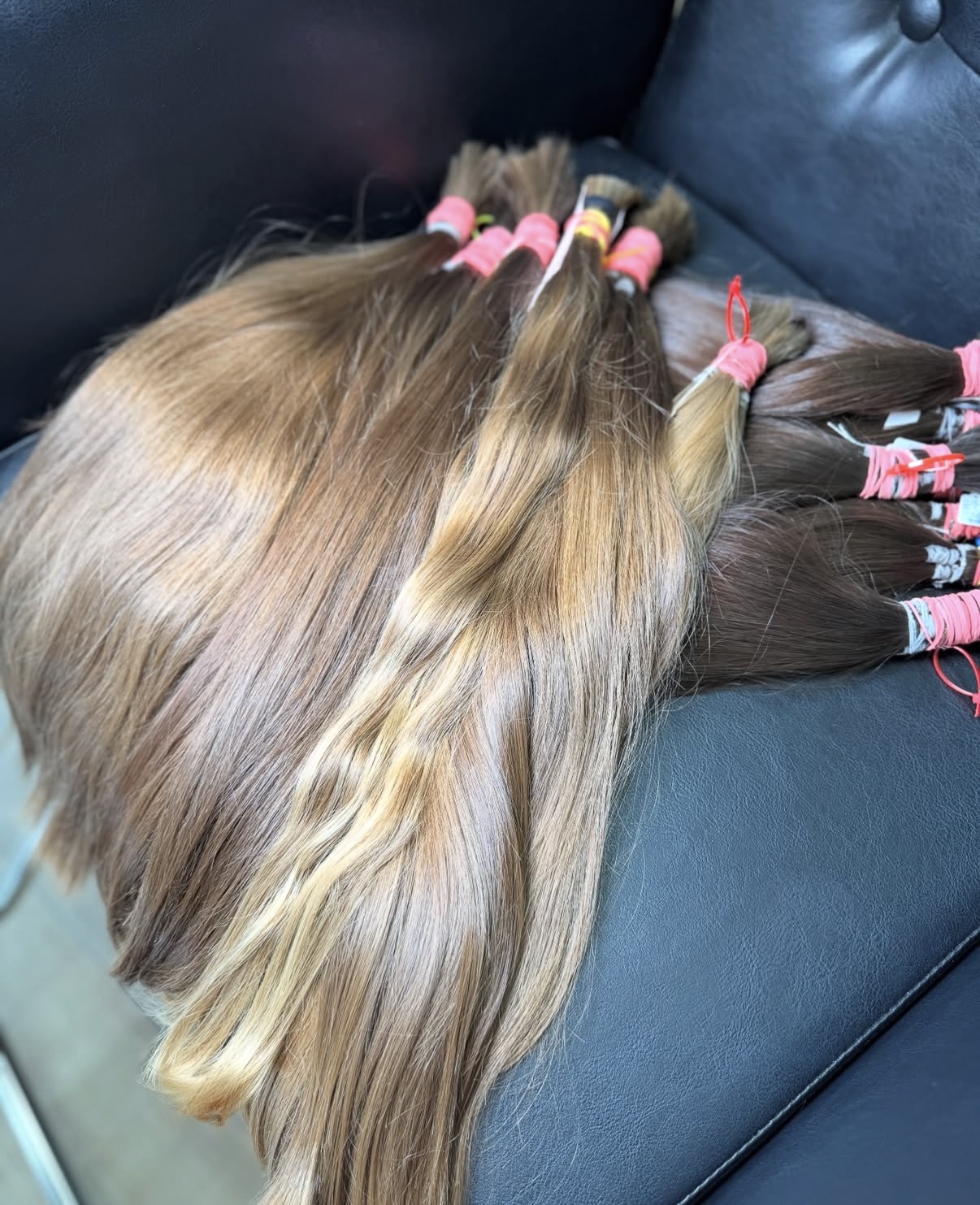 Unprocessed light brown virgin hair ponytails grouped for grading