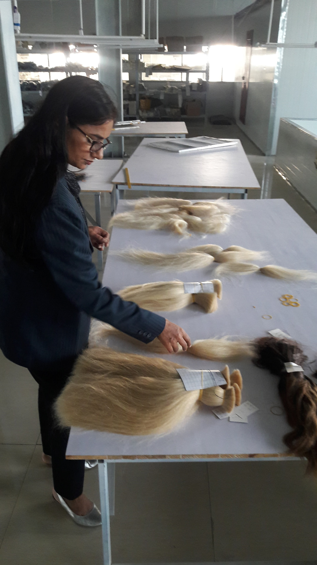 Wefted hair inspected for body, edge and weight consistency